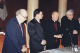 Diplomato dr. Stasio Antano Bačkio 90-mečio minėjimas Vilniaus universitete 1996 metais. 
Iš kairės: dr. Stasys Antanas Bačkis, Vilniaus universiteto rektorius Rolandas Povilionis, profesorius kunigas Antanas Liuima ir vyskupas Jonas Boruta. Naudojimo teisių informacija: Pasvalio Mariaus Katiliškio viešoji biblioteka